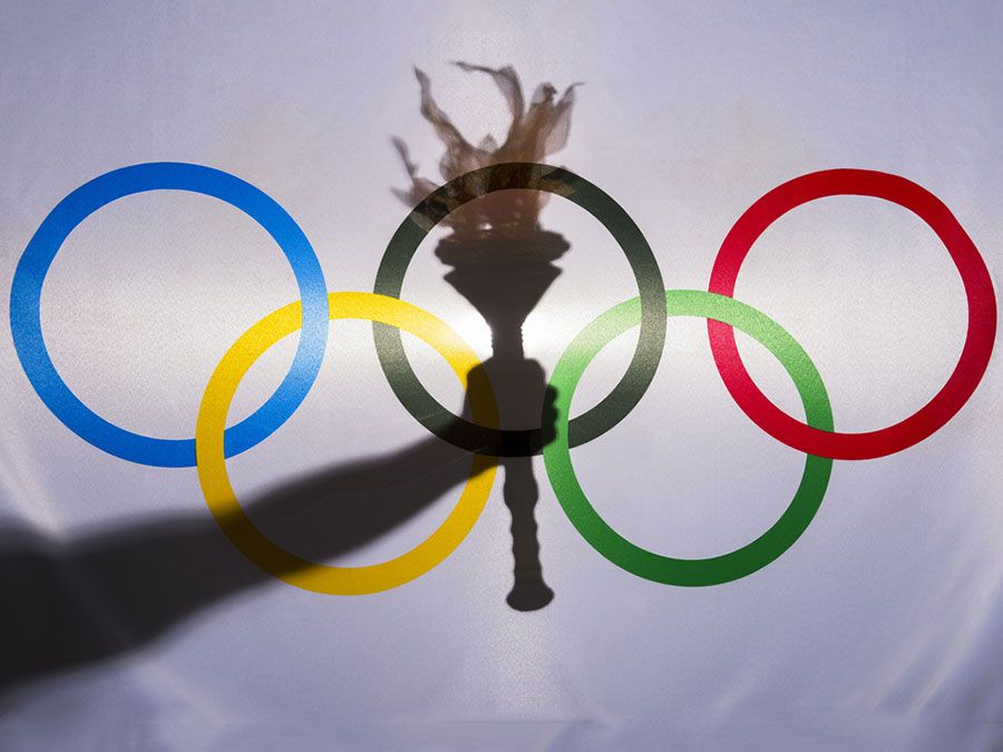 Silhouette hand sport torch flag rings Olympic February 3 2015