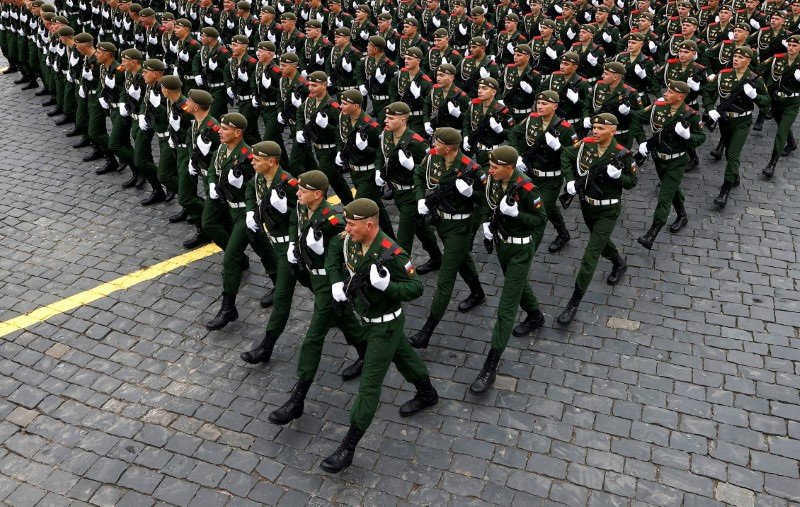 FILE PHOTO: Russian service members march during a military parade on Victory Day, which marks the 76th anniversary of the victory over Nazi Germany in World War Two, in Red Square in central Moscow, Russia May 9, 2021